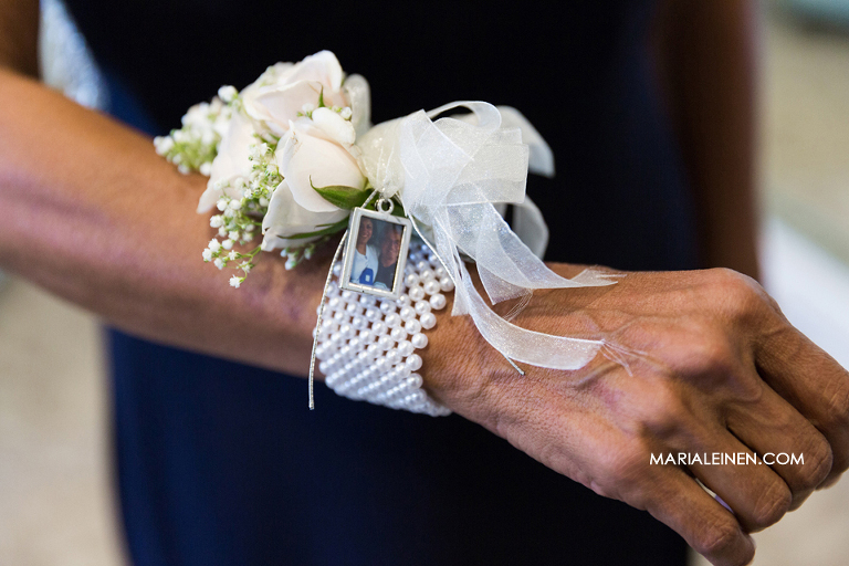 wrist corsage with memory charm for bride's mom