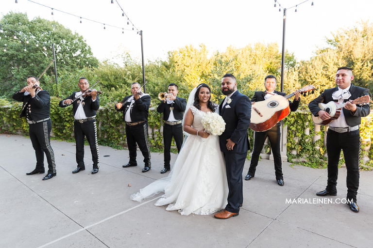 bride and groom photo with mariachi band