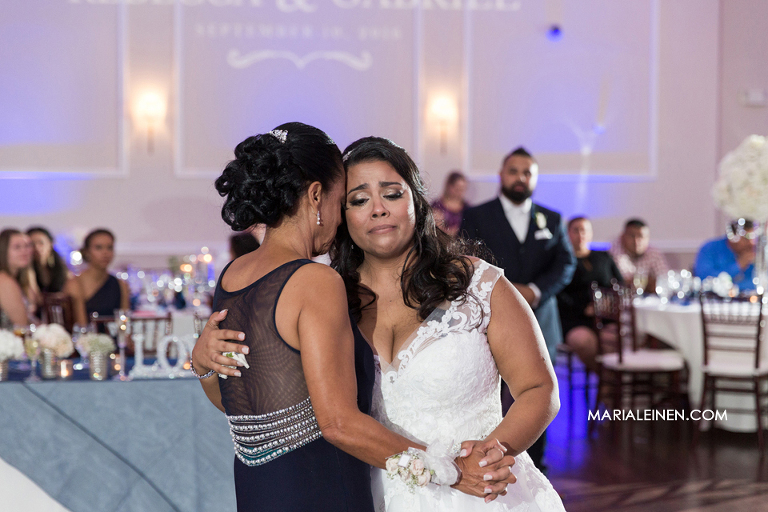 bride cries during parent dance